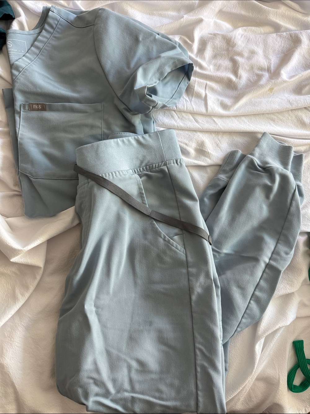 FIGS LIGHT BLUE SCRUP TOP AND JOGGERS WITH DARK GREY TIE